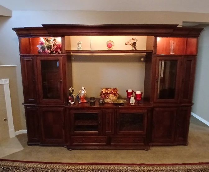 This is a fabulous solid wood wall unit!  It's actually two shelf units flanking a base sideboard type unit, connected with a shelf and decorative cornice.  Excellent condition!  It is already disassembled and ready for you to load!  If interested, feel free to text for more information, additional pics, dimensions, or to schedule an appointment for private, on-site viewing.  $250 OBO.
Thanks!
Aaron
901-568-6970 (Text preferred)