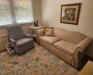 Couch and chair and nice floral rug