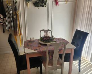 Enamel Top table, vintage aprons, Hummel plates 