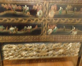 This photo shows the lovely gold hand carving of Fu Lions flying through the clouds