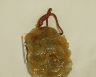 Jade Amulet.   Two dragon s chasing the Pearl of Eternal Life.