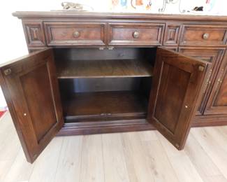 Open doors on the left side of the buffet showing shelf.