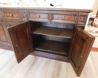 Open doors on the right side of the buffet showing shelf