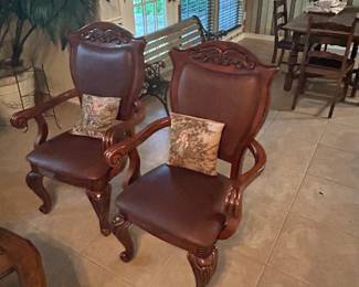 Wood and leather armchairs