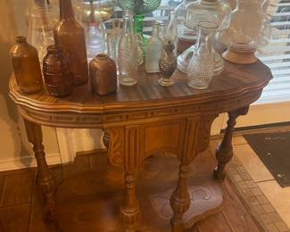 Fantastic side table. Uranium glass lamp!! Vintage Dr Pepper bottles & medicine bottles