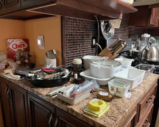 Many kitchen items. Vintage Corning Ware, Stainless Tea Kettle, Iron Skillet, Coffee Grinder, Chicago Cutlery Block & Set of Knives, etc