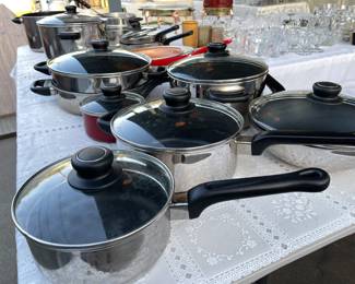 Many nice pots and pans for sale.