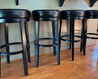 Set of four leather swivel bar stools