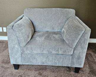 One of two large comfy chairs - light gray in color - like new condition