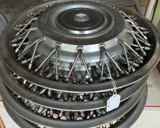 set of four vintage hubcaps