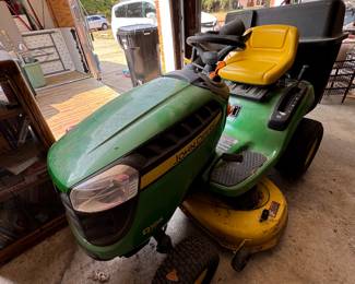 D105 John Deere riding lawnmower with attachment