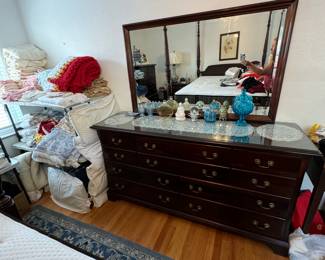 Mahogany bedroom set which includes dresser with mirror, chest, poster bed queen size and matching nightstand