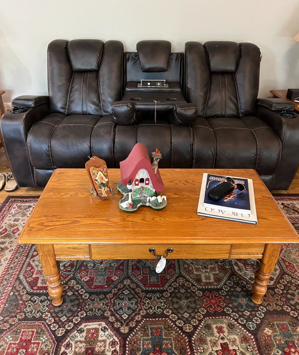 SOLD-Brown Leather sofa.
coffee table, wood items by Fred Von Tobel
