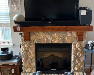 Electric Stone Fireplace, TV, //   Outside yard art not included
