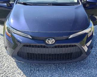 2021 Blue Toyota Corolla  86,073 miles, clean car, has scratches on hood, trunk hood, driver door  $12,875.00  1 of 3 photos