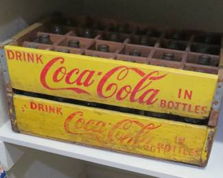 Vintage Coca-Cola bottle crates and bottles