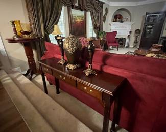 Sofa table, red sofa, lots of home decor