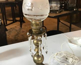 Brass electrical lamp with etched glass light cover.