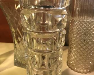 A variety of glass and crystal vases, beverage, dining and decor pieces.