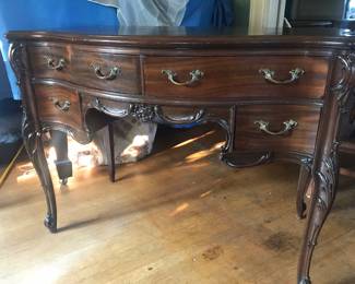 Gorgeous desk with ornate carvings.