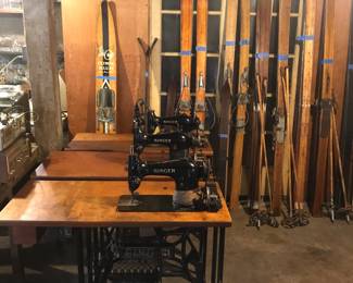 Vintage sewing machines, skis, ski poles, and water ski!