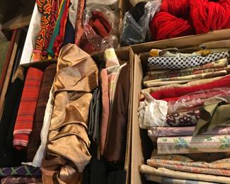 Tons of vintage fabrics and wool yarn.