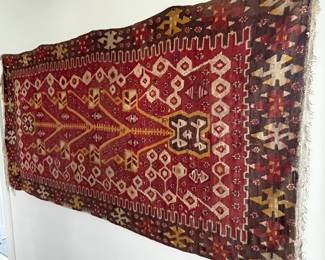 Turkish rug hanging on wall, was hung with the back side facing out, please see next picture.  Measures approximately 7' x 3.5'