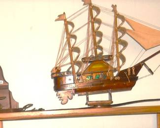 Handmade sword.  Old clock, Wooden Model ship with sails.