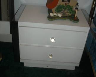 Unique modern style furniture..white with clear acrylic knobs.  Upright chest of drawers, nightstand and headboard.  As shown with a nice 4 poster metal framed bed.