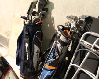 Assorted golf clubs