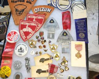 Oilzum patches, license plate toppers, pins