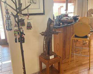 Metal coat tree and Ben Ortega St. Francis