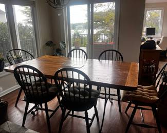 Rustic wood table with black iron base