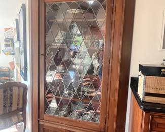 Antique corner cupboard with leaded glass door 
