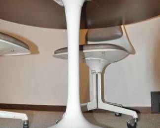 Up Close View of the White Fiberglass Base on the 48" Round Tulip Dining Table.