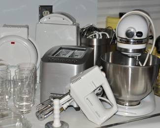 More Great Kitchen Appliances including a Kitchenaid Mixer with Additional Bowls and Attachments, a newer Breville 2 Slice Toaster, a Toast Master Waffle Maker, a Perfect Bagel Slicer and a Black and Decker Spatula Smart Hand Mixer.