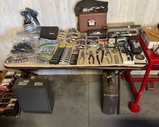 Table full of craftsman tools of all kinds
