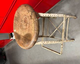 Old iron stool with wood seat. This came out of war department ( see tag )