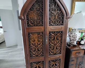 vintage Gothic arched bar cabinet 
