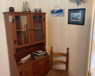 Small cupboard, antique chair, whale wall decor