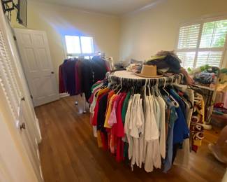 Racks of organized clothing. ALL LIME NEW. MANY NEW WITH TAGS. 