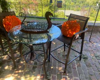 Tall bistro table and chairs. There are 2 more identical tables new in boxes. Perfect opportunity for matching tables. Perfect inside or outside. 
