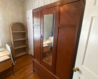 Antique wardrobe. Excellent condition. Bottom drawer. Mirror on front.  Large storage. 