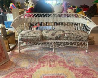 Antique wicker sofa and cushions. Classic. 