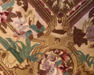 DETAIL OF CORNER OF AREA RUG