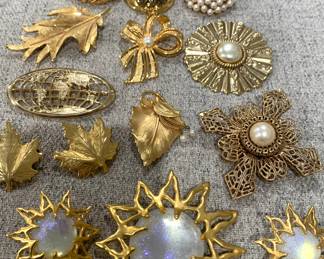 Just a small sampling of gold tone brooches