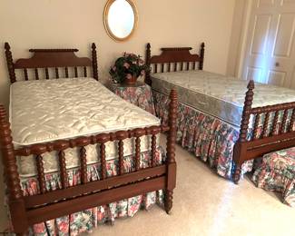 set of twin beds (mattresses priced separately)