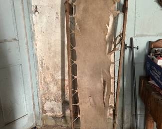 Original canvas military cot/stretcher attached to a bentwood frame.