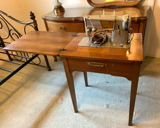 #52	Metal Singer 328 Sewing Machine in Cabinet	 $50.00 
