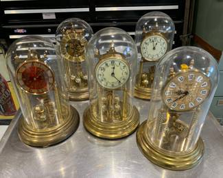 Brass base anniversary clocks, some porcelain faced 